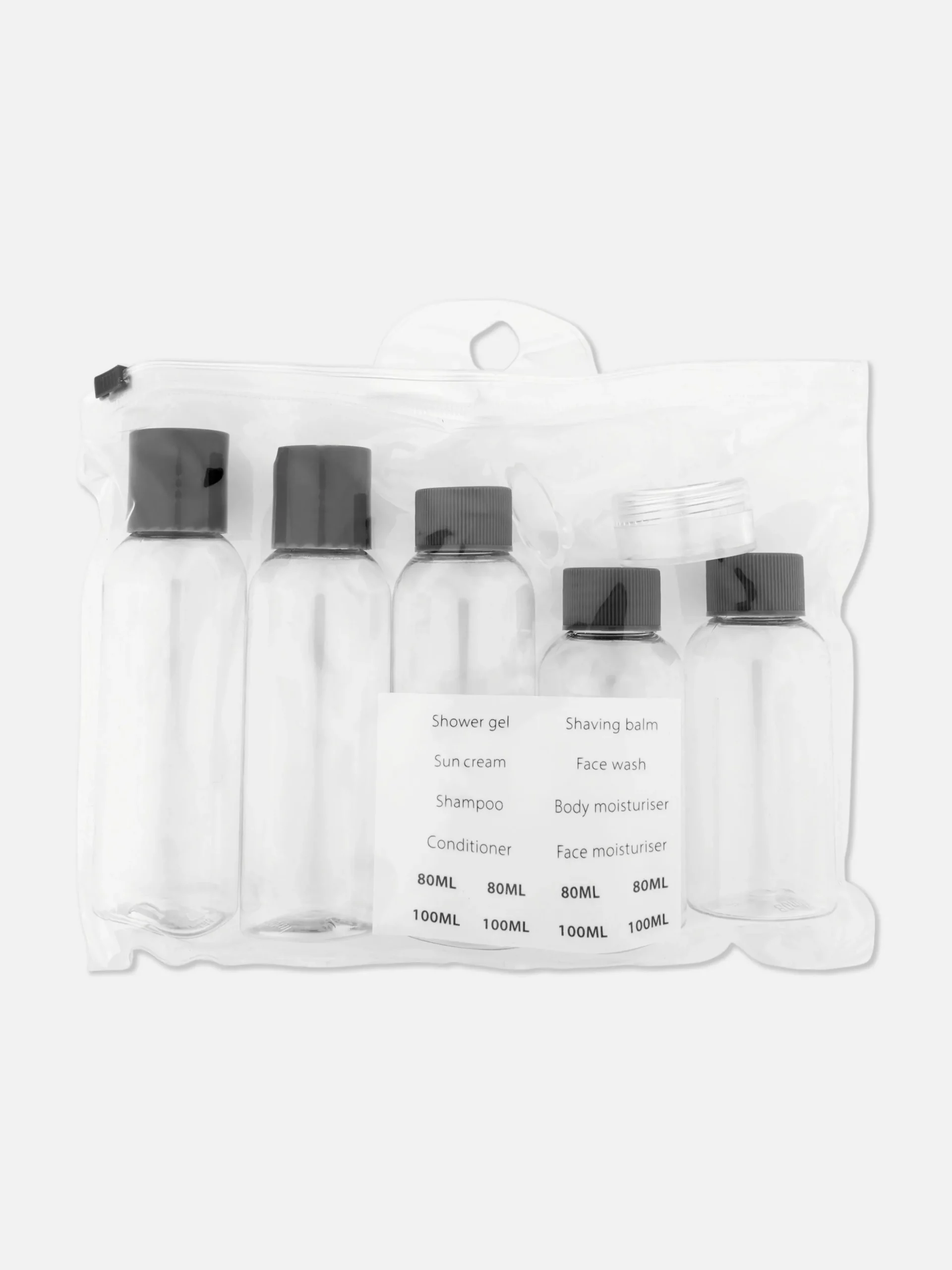 Ensemble De Flacons De Voyage Et D'étiquettes